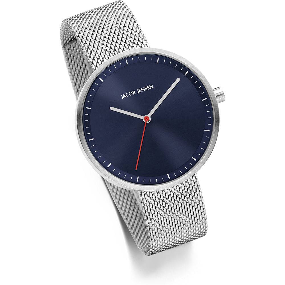 Jacob Jensen Strata dameshorloge JJ289 36mm met blauw wijzerplaat en zilverkleurige mesh band. Luxe en minimalistisch ontwerp.